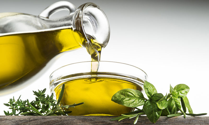 Why do Greeks eat less extra virgin olive oil?