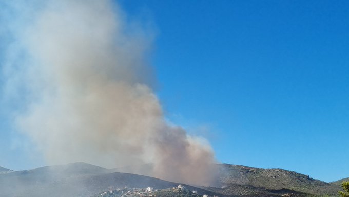 Wildfire at Drafi site atop Mt. Penteli, overlooking Athens